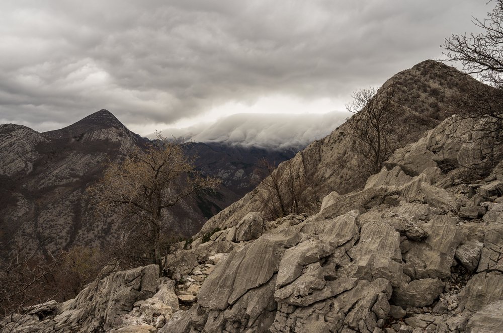 High up on the hills leaving the Grabove Doline area with storm clouds falling over the Velebit mountains.